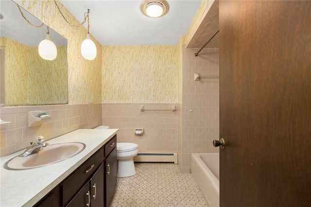 49 Magnolia Ln, Coventry, RI 02816 - full bathroom featuring tile walls, baseboard heating, a wainscoted wall, vanity, and toilet