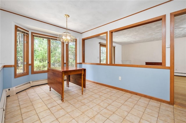 unfurnished dining area featuring baseboards, a baseboard heating unit, and a chandelier