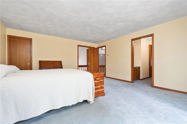 carpeted bedroom with baseboards