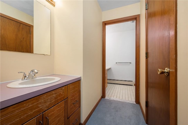 bathroom featuring vanity, a baseboard radiator, and baseboards