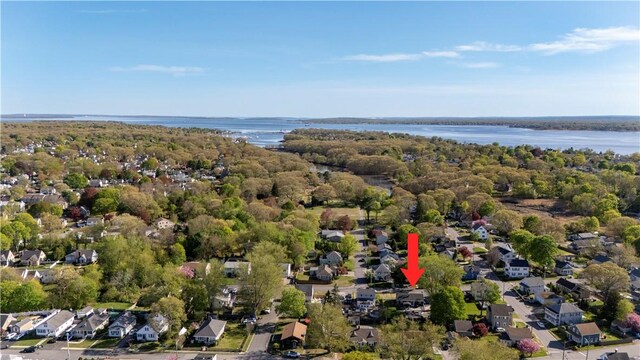 birds eye view of property featuring a water view and a residential view