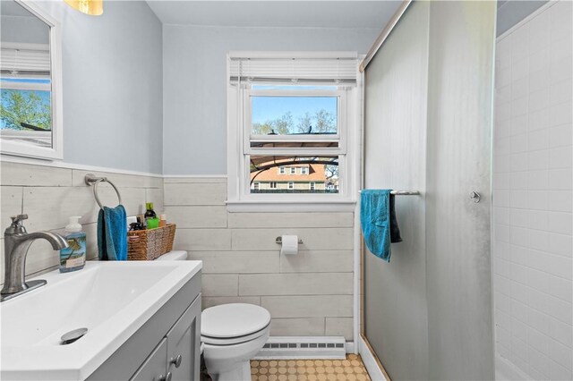 full bath with toilet, tile walls, visible vents, and vanity