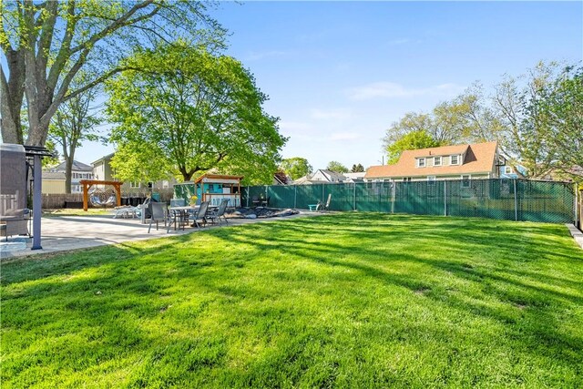 view of yard with a patio area and fence