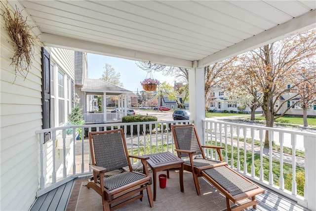 exterior space featuring covered porch and a residential view