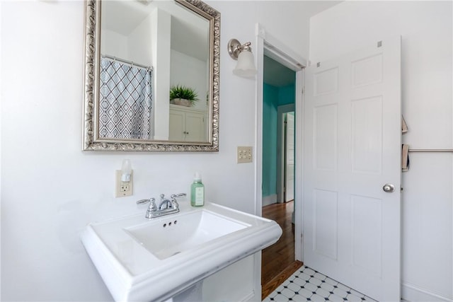 full bathroom with a sink