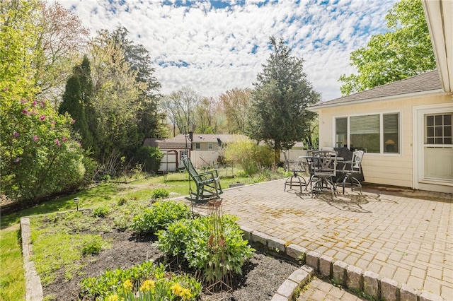 view of patio featuring outdoor dining area