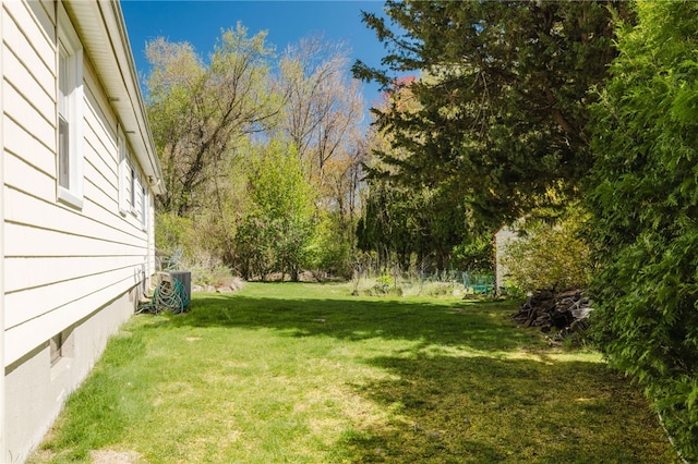 view of yard featuring central AC unit