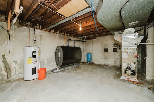 unfinished basement featuring heating unit, heating fuel, and water heater