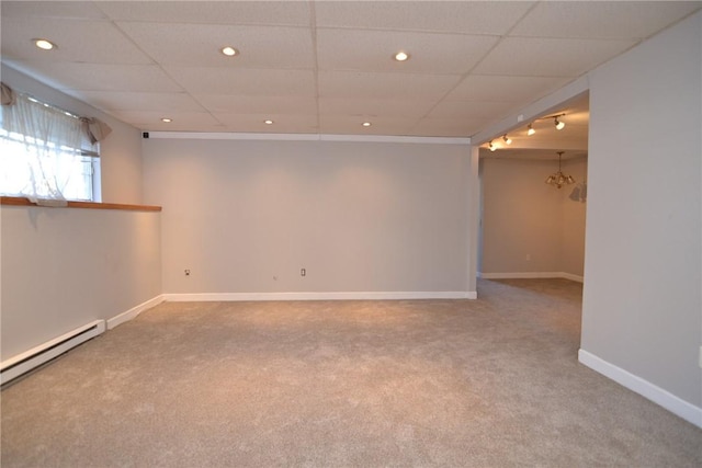 300 Smithfield Rd Unit P1-1, Providence, RI 02904 - below grade area with carpet floors, baseboards, baseboard heating, and a drop ceiling