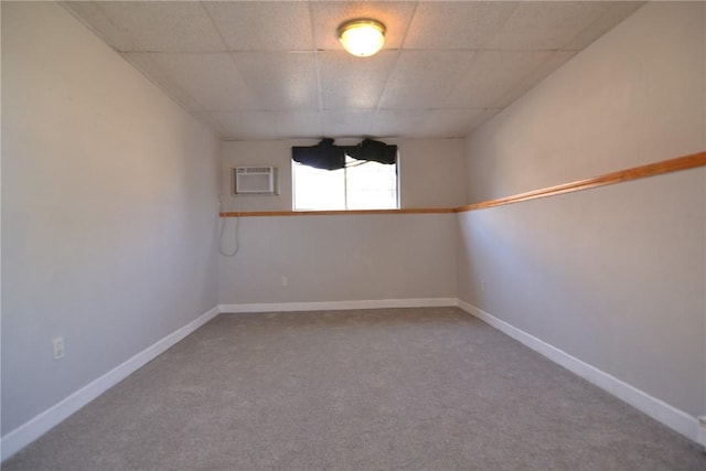 300 Smithfield Rd Unit P1-1, Providence, RI 02904 - empty room featuring baseboards, a wall mounted AC, a paneled ceiling, and carpet