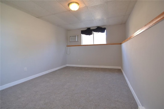 300 Smithfield Rd Unit P1-1, Providence, RI 02904 - carpeted spare room with baseboards, a paneled ceiling, and a wall mounted air conditioner