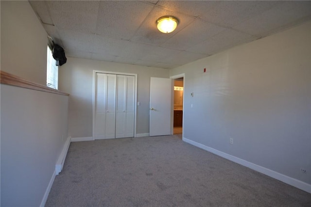 300 Smithfield Rd Unit P1-1, Providence, RI 02904 - unfurnished bedroom with carpet flooring, baseboards, a drop ceiling, and a closet