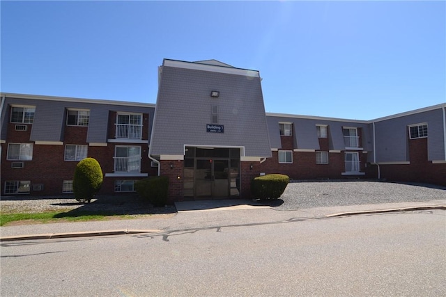 300 Smithfield Rd Unit P1-1, Providence, RI 02904 - view of front of property with an attached garage, driveway, and brick siding