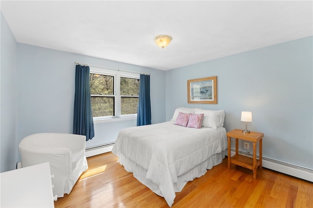 29 Howard Ave, Scituate, RI 02831 - bedroom featuring baseboard heating and light wood finished floors