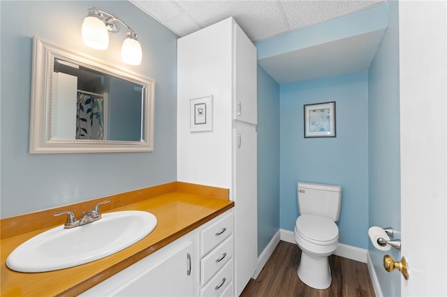 29 Howard Ave, Scituate, RI 02831 - full bath with vanity, toilet, baseboards, wood finished floors, and a shower with curtain
