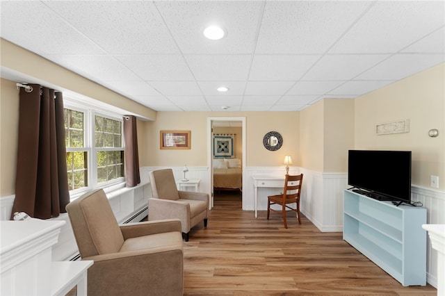 29 Howard Ave, Scituate, RI 02831 - sitting room featuring wainscoting, light wood-style flooring, recessed lighting, a drop ceiling, and a baseboard radiator