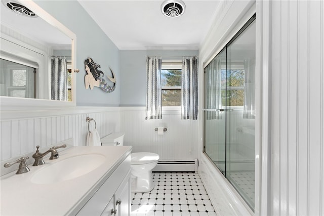 29 Howard Ave, Scituate, RI 02831 - bathroom featuring visible vents, wainscoting, a baseboard radiator, toilet, and ornamental molding