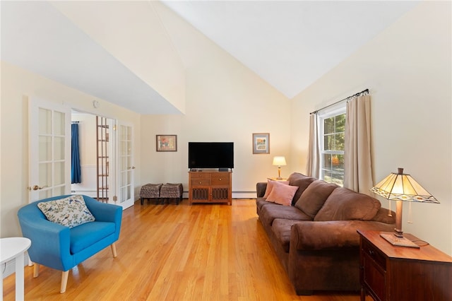 29 Howard Ave, Scituate, RI 02831 - living area featuring french doors, a baseboard radiator, light wood-style flooring, and high vaulted ceiling