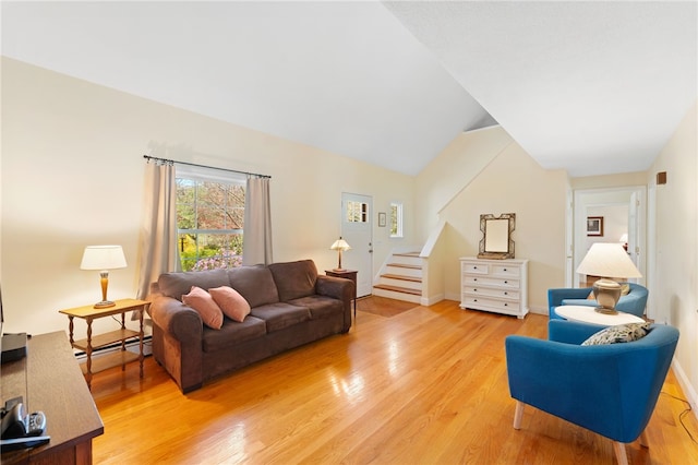 29 Howard Ave, Scituate, RI 02831 - living room with baseboards, stairway, baseboard heating, and light wood finished floors