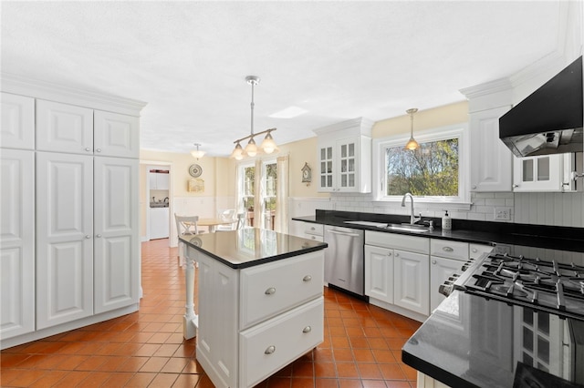29 Howard Ave, Scituate, RI 02831 - kitchen with tile patterned flooring, dark countertops, ventilation hood, a sink, and dishwasher