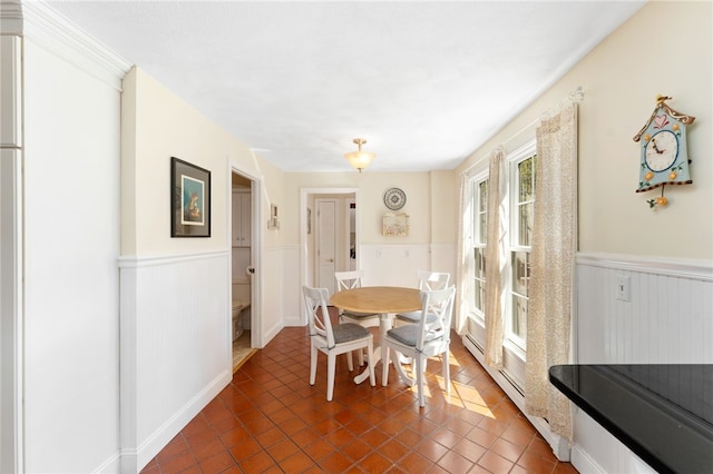 29 Howard Ave, Scituate, RI 02831 - dining space with wainscoting and dark tile patterned flooring