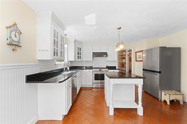 29 Howard Ave, Scituate, RI 02831 - kitchen featuring dark countertops, stainless steel appliances, white cabinetry, under cabinet range hood, and dark tile patterned flooring