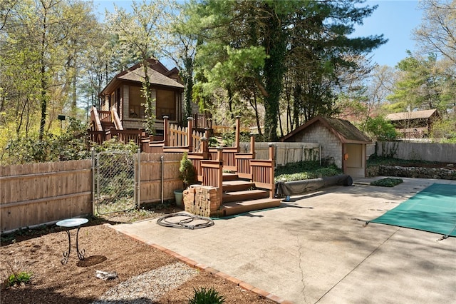 29 Howard Ave, Scituate, RI 02831 - rear view of house with a patio, a shed, a fenced backyard, a fenced in pool, and an outdoor structure