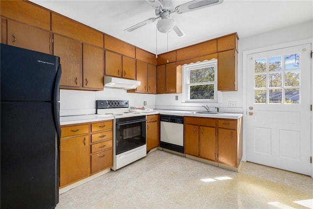 kitchen with a ceiling fan, brown cabinets, light countertops, under cabinet range hood, and white appliances