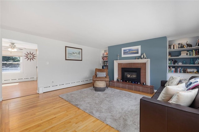 289 Oliphant Ln, Middletown, RI 02842 - living room with a fireplace, baseboard heating, and wood finished floors