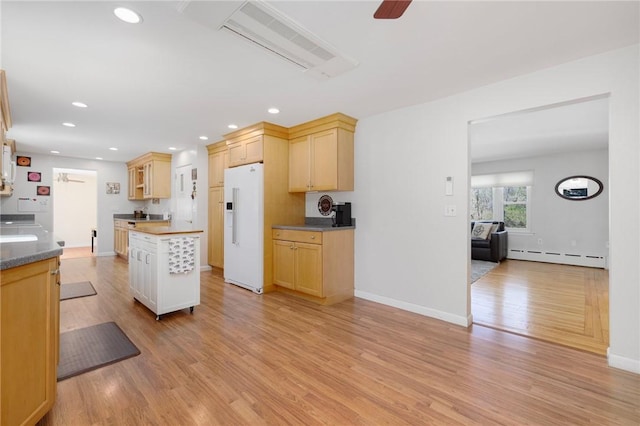 289 Oliphant Ln, Middletown, RI 02842 - kitchen featuring light wood-style floors, white refrigerator with ice dispenser, baseboard heating, recessed lighting, and a ceiling fan