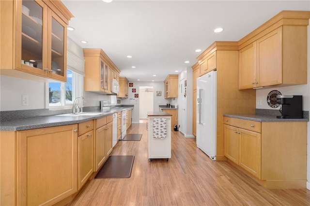 289 Oliphant Ln, Middletown, RI 02842 - kitchen with light brown cabinetry, white appliances, light wood-style flooring, recessed lighting, and glass insert cabinets