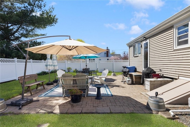 289 Oliphant Ln, Middletown, RI 02842 - view of patio featuring outdoor dining area and a fenced backyard