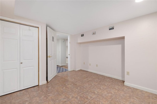 289 Oliphant Ln, Middletown, RI 02842 - unfurnished bedroom featuring baseboards and a closet