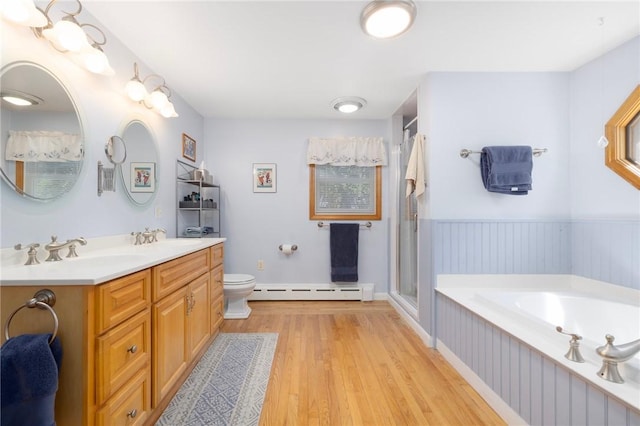 289 Oliphant Ln, Middletown, RI 02842 - bathroom featuring wood finished floors, a bath, a baseboard heating unit, a sink, and a stall shower