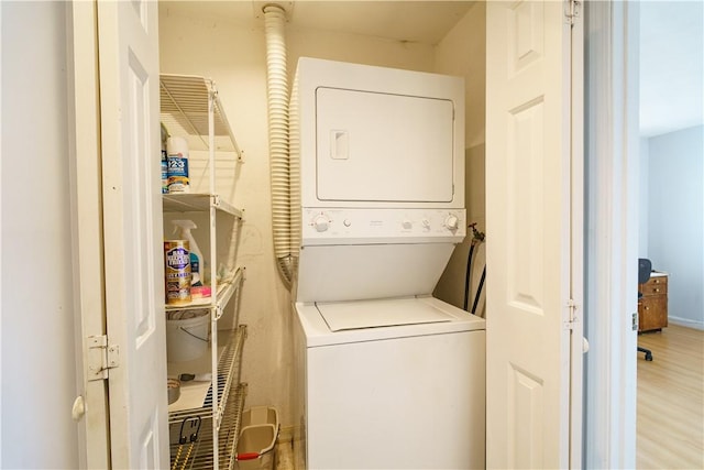 51 Scenic Dr, West Warwick, RI 02893 - laundry room featuring stacked washer / drying machine, wood finished floors, and laundry area