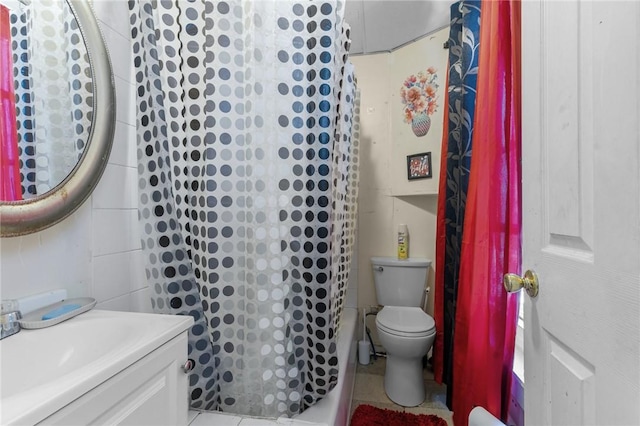 full bathroom with vanity, tile patterned floors, and toilet