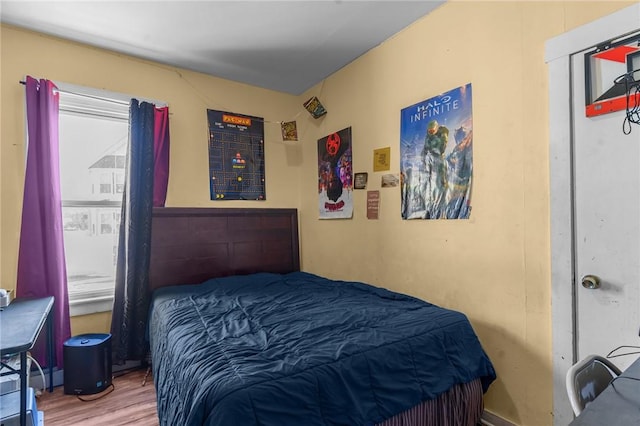 bedroom featuring wood finished floors