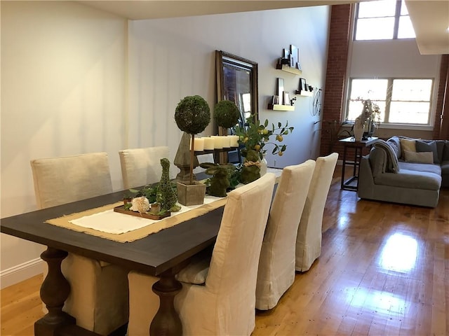 1 Tupperware Dr Unit 233, North Smithfield, RI 02896 - dining room with light wood-type flooring and baseboards