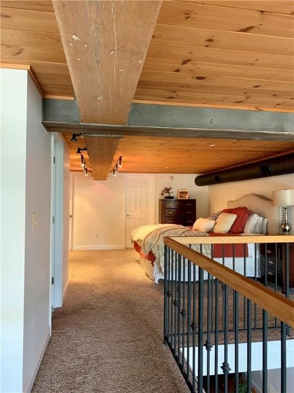 1 Tupperware Dr Unit 233, North Smithfield, RI 02896 - bedroom with wooden ceiling, baseboards, carpet floors, and track lighting