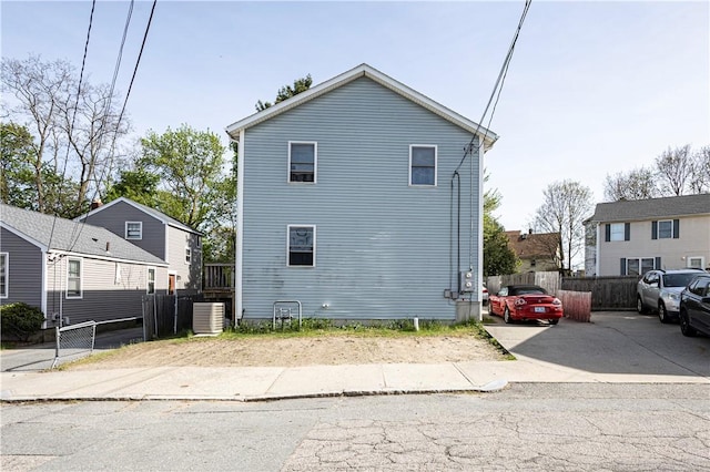 33 Dome St Unit A, Providence, RI 02908 - view of side of property featuring central AC and fence