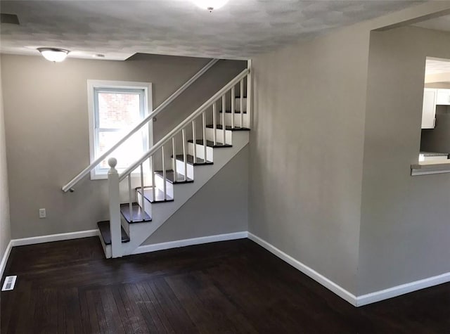 191 Canfield Ave, Warwick, RI 02889 - stairway with baseboards and wood finished floors