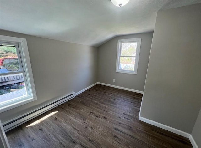 191 Canfield Ave, Warwick, RI 02889 - additional living space with a baseboard radiator, vaulted ceiling, dark wood-style floors, and baseboards