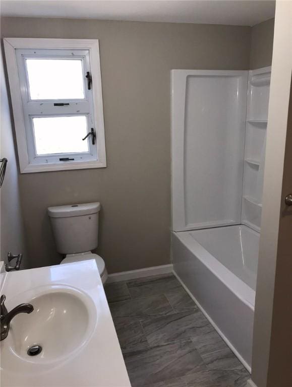 191 Canfield Ave, Warwick, RI 02889 - bathroom featuring a sink, toilet, and baseboards