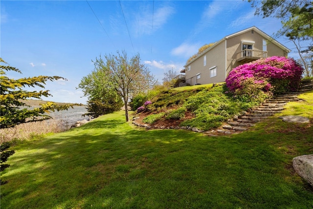 view of yard featuring a balcony