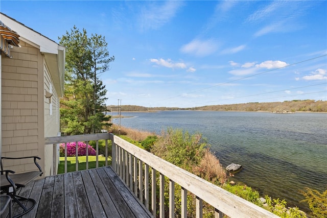 wooden terrace with a water view
