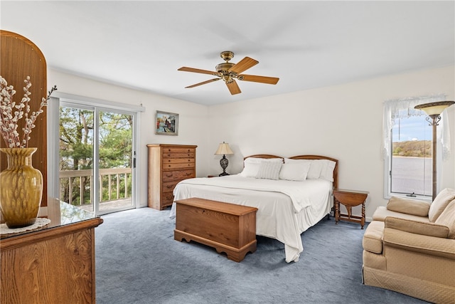 carpeted bedroom with ceiling fan and access to exterior