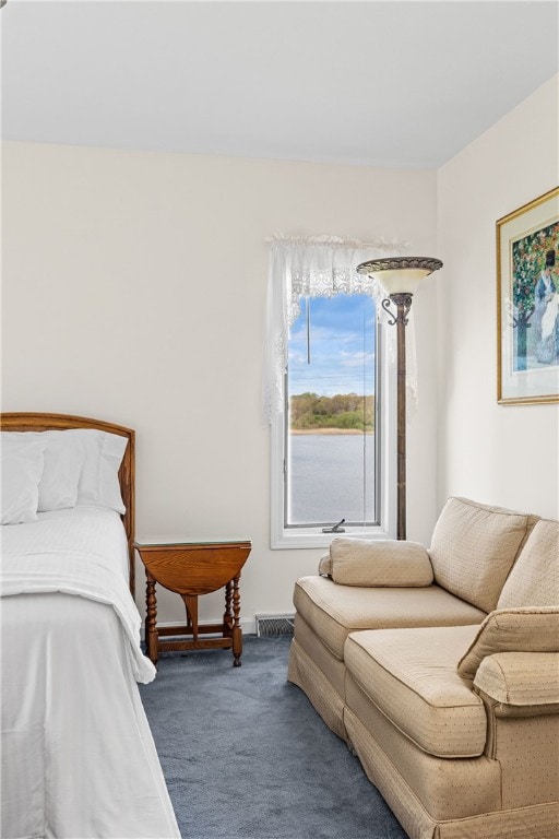bedroom with visible vents, carpet flooring, and baseboards