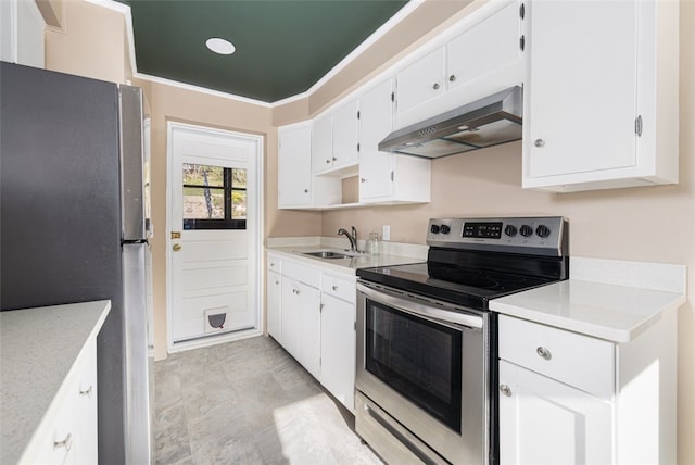 kitchen with white cabinets, appliances with stainless steel finishes, a sink, light countertops, and under cabinet range hood