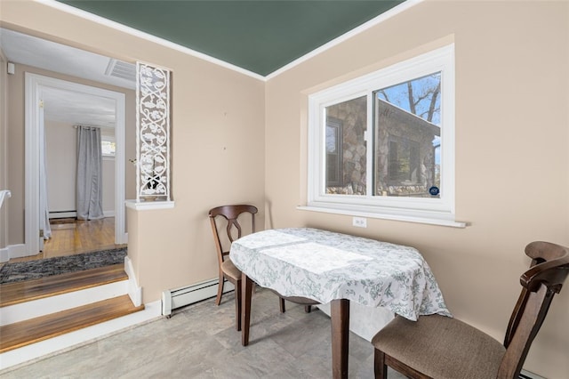 dining room featuring baseboards, a baseboard radiator, and crown molding