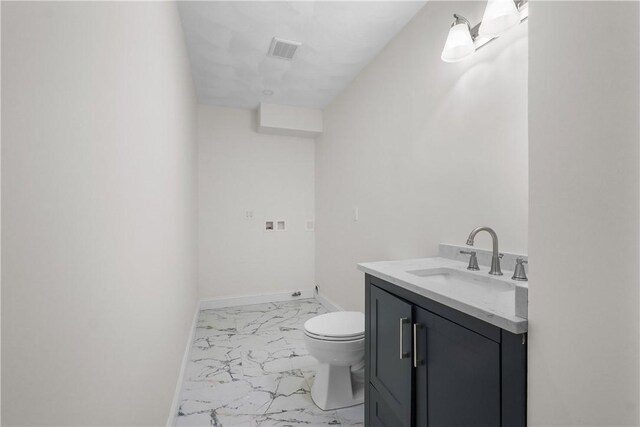 bathroom featuring vanity, toilet, marble finish floor, baseboards, and visible vents
